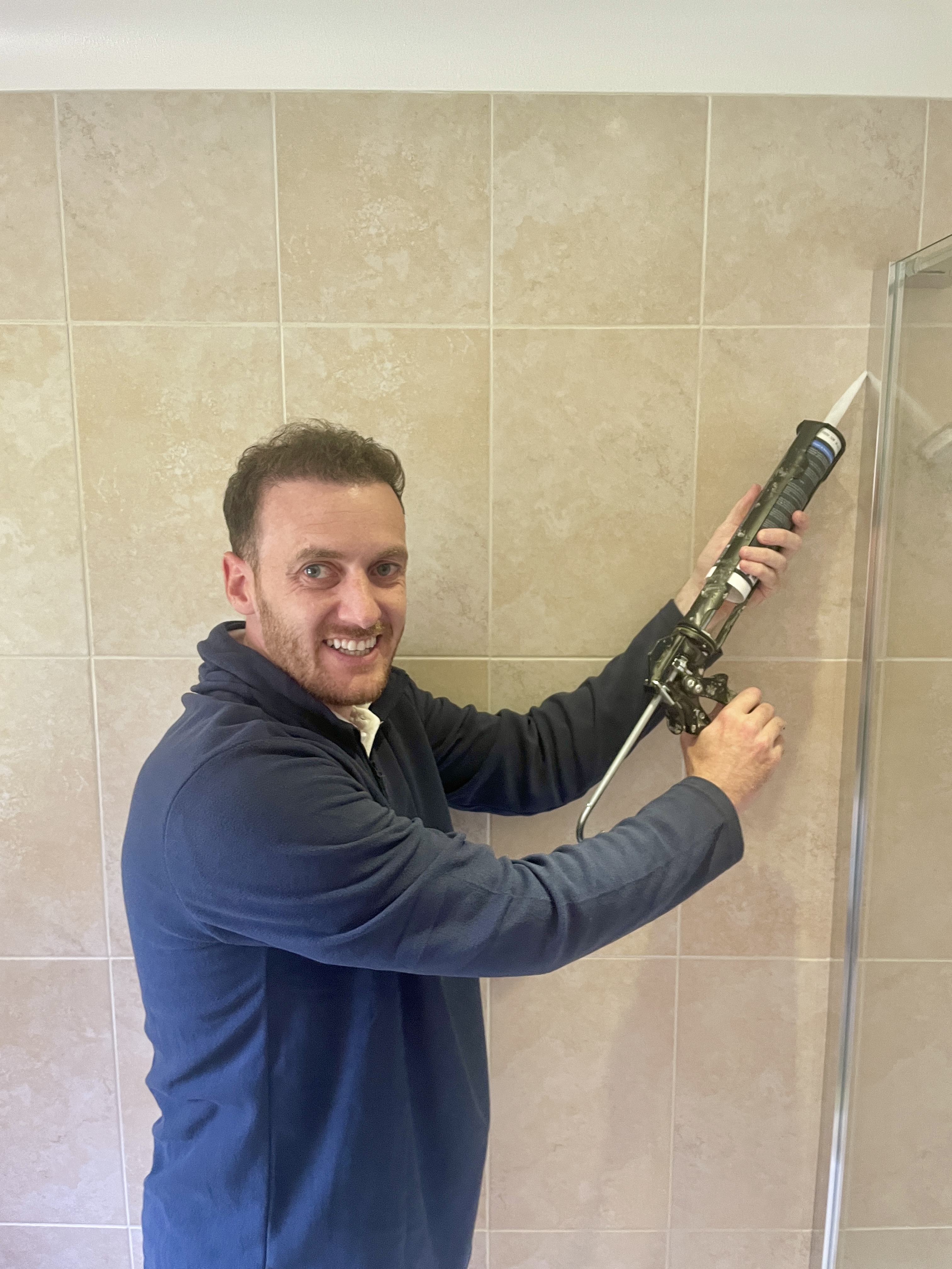 Professional sealant application in bathroom